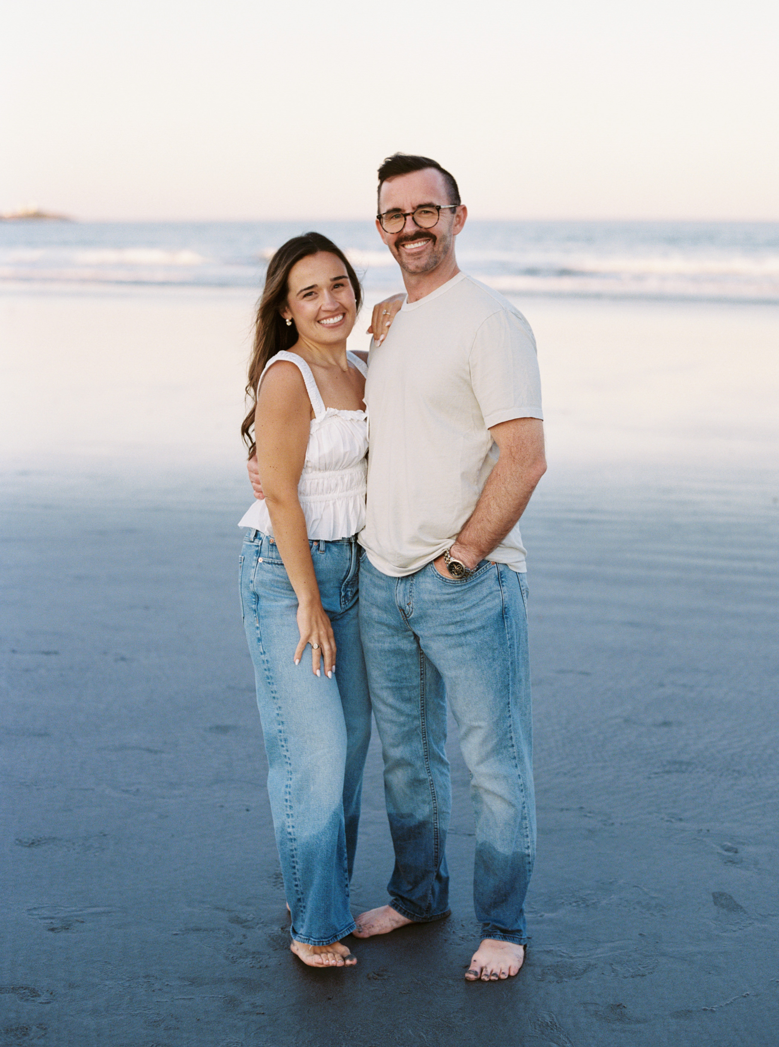 Julianne and Morgan smiling together at sunset