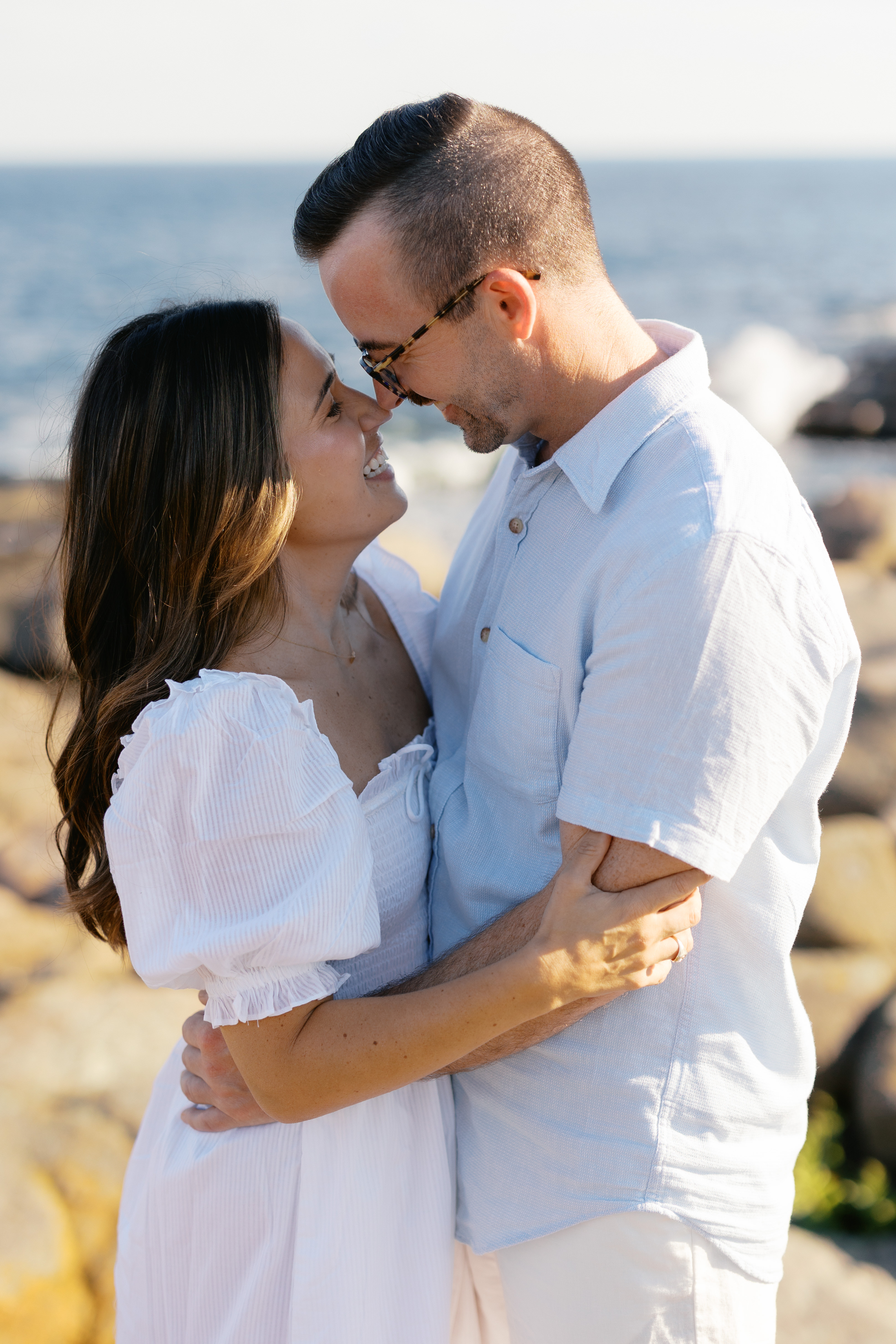Julianne and Morgan sharing a close moment on the rocks